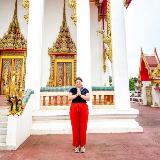 A solo traveller at a temple in Thailand